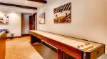 Shuffle board in lower level entertainment room
